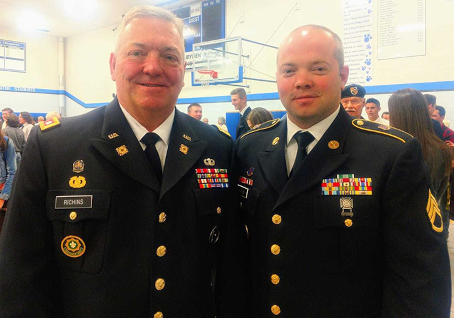 Idaho Army National Guard Staff Sgt. Tyler Richins with his father, Lt. Col Dwight Richins, in an undated photo. Dwight Richins retired from the Idaho Army National Guard in 2012 and inspired his son to serve in the Idaho Army National Guard and to become a high school football coach. Tyler Richins won his first state title as a coach Nov. 17. Dwight Richins coached his teams to five state titles, including one in 1999 when Tyler Richins was his quarterback.