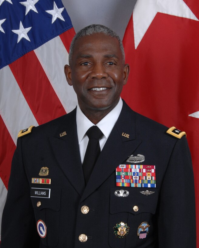 A portrait of Army Lieutenant General Darrell K. Williams against with a U.S. flag and a three-star flag in the background.