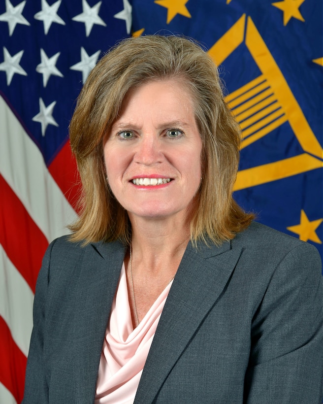 A portrait of DLA Chief of Staff Kristin K. French with the U.S. flag and the Senior Executive Service flag in the background.