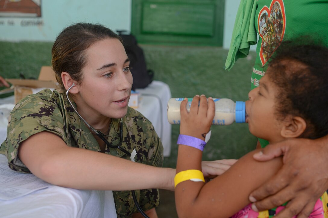 RIOHACHA, Colombia (Nov. 28, 2018) – Ensign Abigail Howard, from Rochester, N.Y., checks a patient’s heartrate at one of two medical sites. The hospital ship USNS Comfort (T-AH 20) is on an 11-week medical support mission to Central and South America as part of U.S. Southern Command’s Enduring Promise initiative.