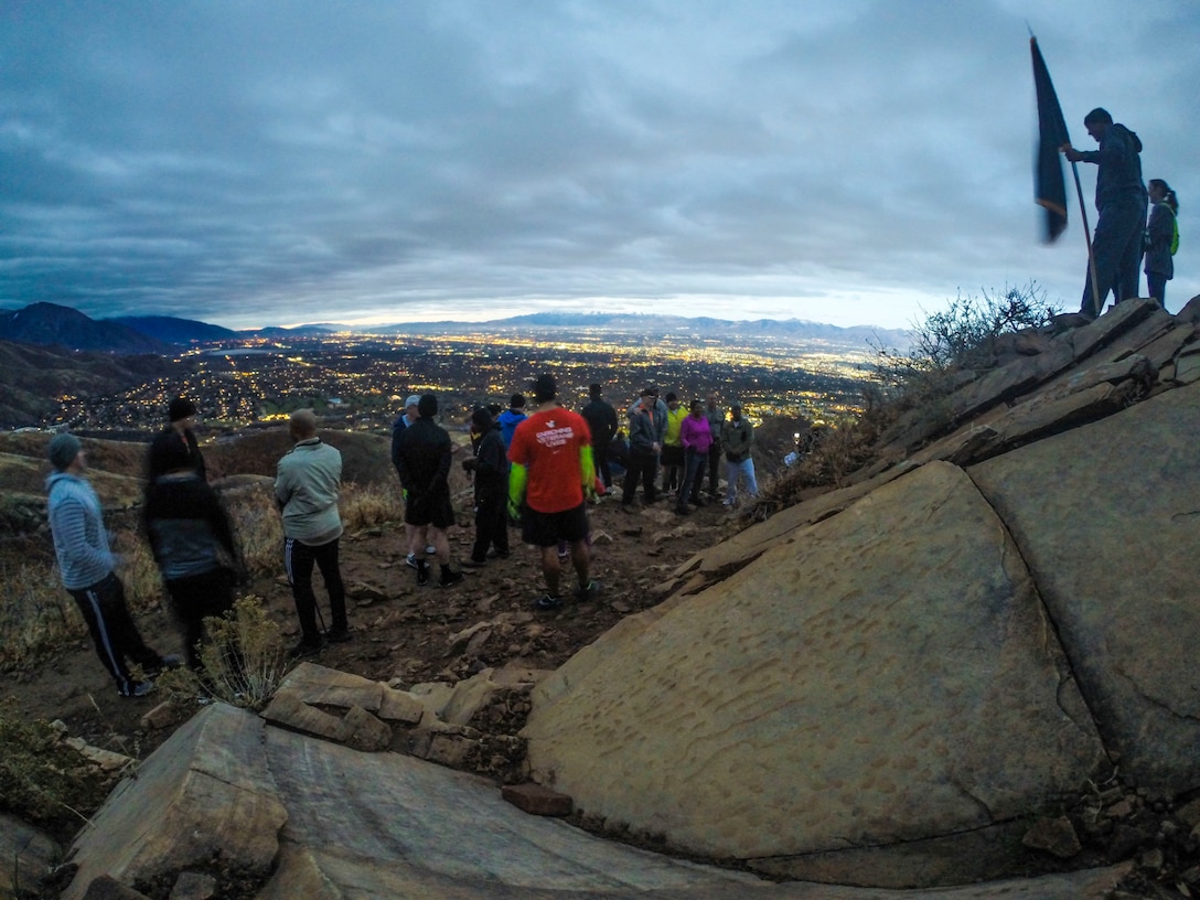 Army Reserve Soldiers from the 76th Operational Response Command pause to catch their breath and take in the spectacular valley views after climbing the "Living Room" trail in Salt Lake City, Utah Nov. 3.  The climb, led by Brig. Gen. Doug Cherry, commanding general, 76th ORC and Command Sgt. Maj. Jeff Darlington, command sergeant major, 76th ORC was part of a team-building event at the annual Commander's Conference for brigade and battalion commanders and sergeant's major.  The trail ascents more than 1,000 feet in approximately 2.4 miles, taking hikers to an elevation of nearly 6,000 feet while providing breath-taking views of the Salt Lake Valley. (Official U.S. Army Reserve photo by Sgt. 1st Class Brent C. Powell)