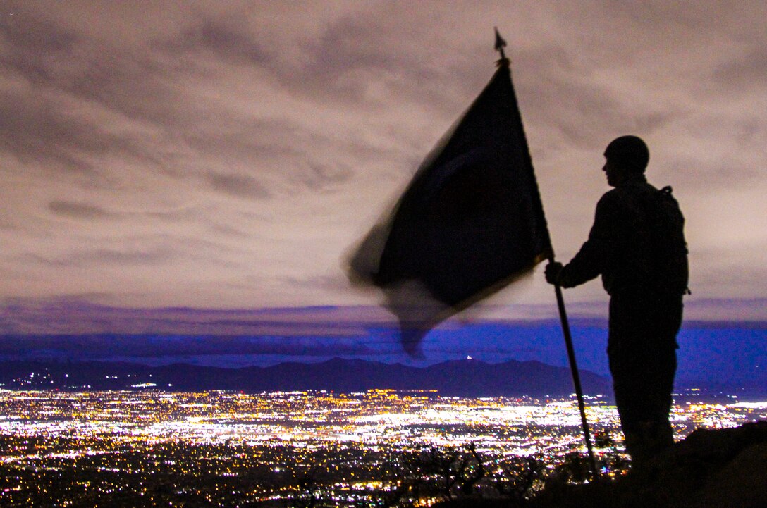 Army Reserve Command Sgt. Maj. Jeff Walker, command sergeant major, 450th Chemical Battalion, 209th Regional Support Group, 76th Operational Response Command, pauses to check out the view after making it to the top of the "Living Room" trail in Salt Lake City, Utah, Nov. 3.  The climb, led by Brig. Gen. Doug Cherry, commanding general, 76th ORC and Command Sgt. Maj. Jeff Darlington, command sergeant major, 76th ORC was part of a team-building event at the annual Commander's Conference for brigade and battalion commanders and sergeant's major.  The trail ascents more than 1,000 feet in approximately 2.4 miles, taking hikers to an elevation of nearly 6,000 feet while providing breath-taking views of the Salt Lake Valley. (Official U.S. Army Reserve photo by Sgt. 1st Class Brent C. Powell)