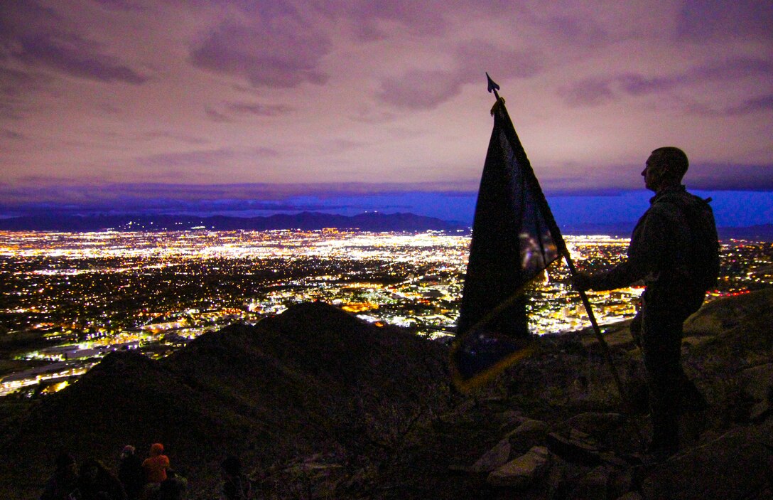 Army Reserve Command Sgt. Maj. Jeff Walker, command sergeant major, 450th Chemical Battalion, 209th Regional Support Group, 76th Operational Response Command, pauses to check out the view after making it to the top of the "Living Room" trail in Salt Lake City, Utah, Nov. 3.  The climb, led by Brig. Gen. Doug Cherry, commanding general, 76th ORC and Command Sgt. Maj. Jeff Darlington, command sergeant major, 76th ORC was part of a team-building event at the annual Commander's Conference for brigade and battalion commanders and sergeant's major.  The trail ascents more than 1,000 feet in approximately 2.4 miles, taking hikers to an elevation of nearly 6,000 feet while providing breath-taking views of the Salt Lake Valley. (Official U.S. Army Reserve photo by Sgt. 1st Class Brent C. Powell)
