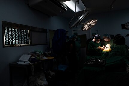 Medical professionals operate on a patient at a hospital in San Pedro Sula, Honduras, Nov. 26, 2018.