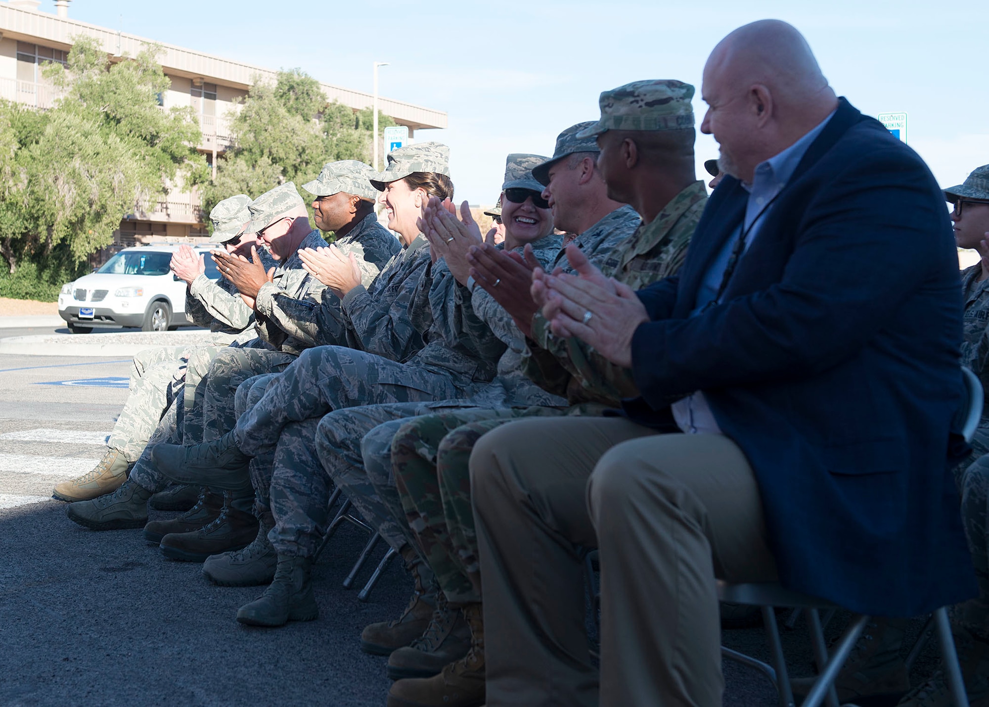 Base leadership, distinguished visitors and veterinary treatment facility staff cut the ribbon to signify the opening of the facility on Nellis Air Force Base, Nev., Nov. 14, 2018. The new facility is 3,600 square feet, which is twice the size of the previous facility. (U.S. Air Force photo by Airman 1st Class Bryan T. Guthrie)