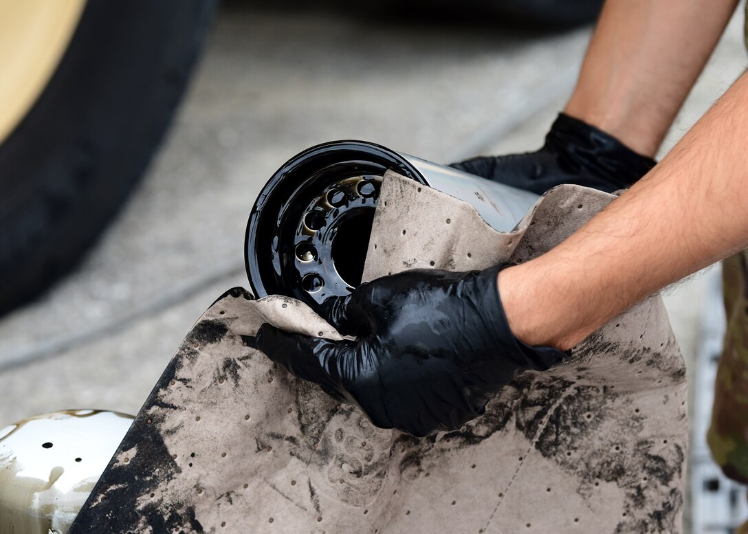 Staff Sgt. Joshua R. Olando, an electrical power production craftsman currently supporting the 325th Civil Engineer Squadron, wipes excess oil from an oil filter Nov. 30, 2018, at Tyndall Air Force Base, Fla. Large-scale recovery efforts have continued in the weeks since Hurricane Michael struck the Florida panhandle and Tyndall. Olando is currently deployed from the 436th Civil Engineer Squadron at Dover Air Force Base, Del. (U.S. Air Force photo by Senior Airman Isaiah J. Soliz)