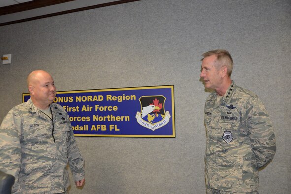 Lt. Col. Don Wilson, 1st Air Force Homecoming Center team leader deployed from the 186th Air Refueling Wing, Key Field Air National Guard Base, Meridian, Miss., discusses the center’s operations with Gen. Terrence O’Shaughnessy, Commander, NORAD and U.S. Northern Command, during the general’s visit to 1st Air Force facilities Nov. 27. (Air Force photo by Mary McHale)
