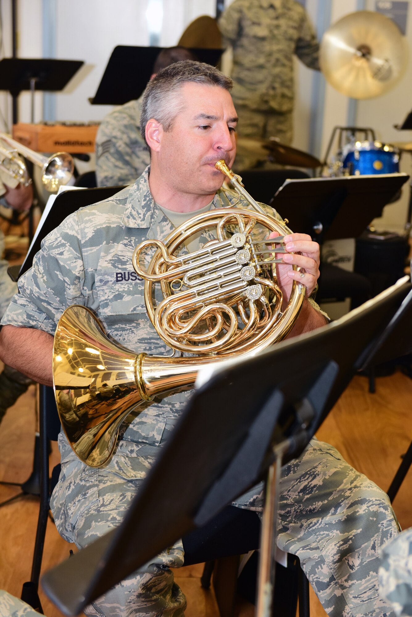 Master Sgt. Jeremy Buss, a french horn player with the Air National Guard Band of the Northeast, rehearses Nov. 17, 2018, for the band’s upcoming annual holiday concert. The concert is scheduled for Dec. 16 at the Auditorium of the Scottish Rite Cathedral, Harrisburg, Pennsylvania, at 3 p.m. and will feature the 35-piece wind-ensemble Concert Band performing several winter and holiday-themed songs. The concert is free and open to the public. (U.S. Air National Guard photo by Tech. Sgt. Claire Behney/Released)