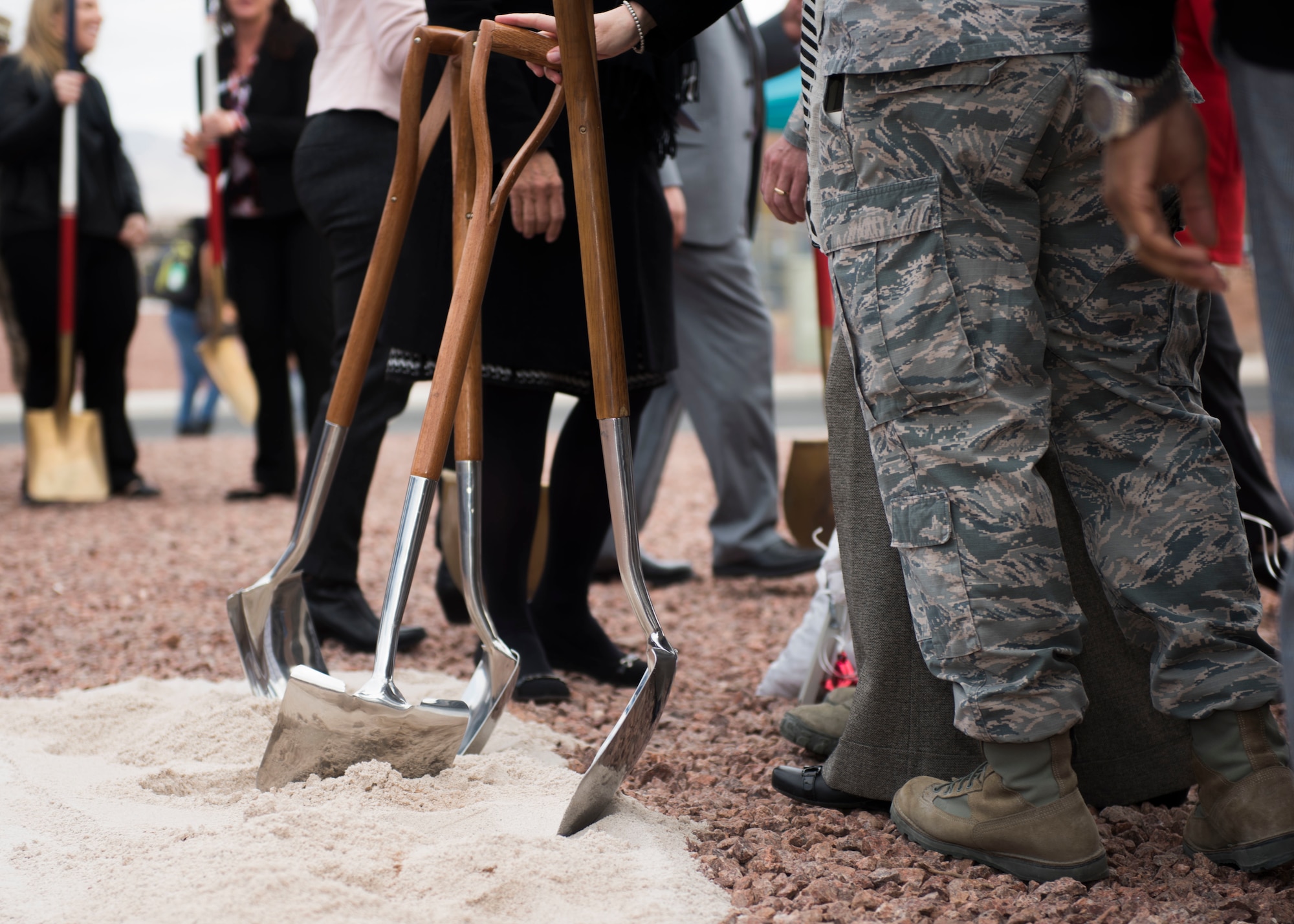 Shovels are dug into the ground.