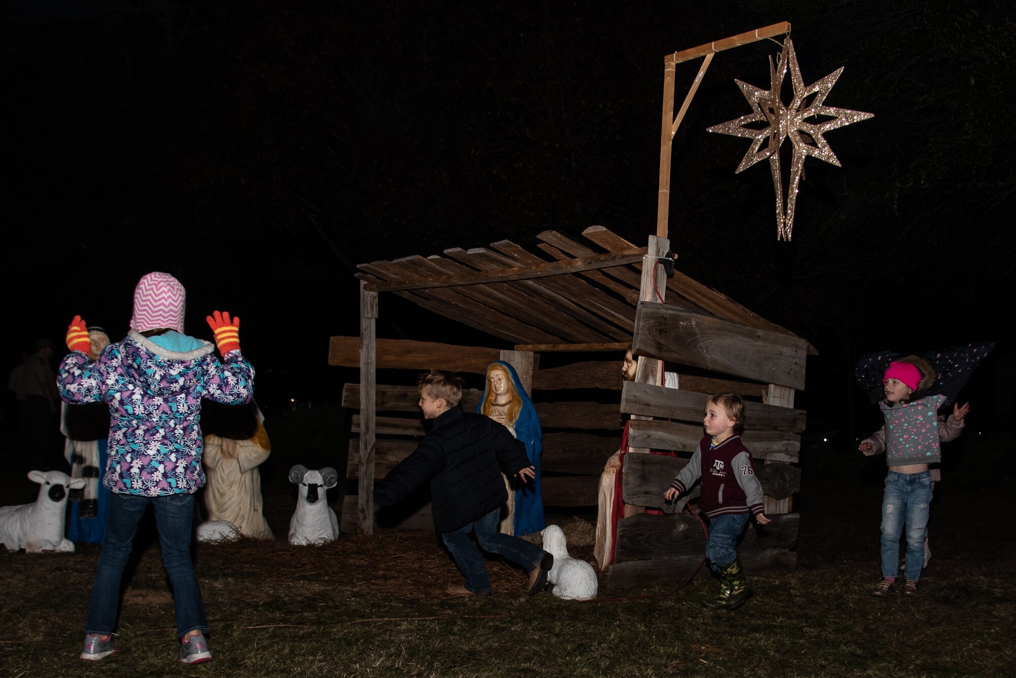 Team Shaw children play prior to the start of the annual Holiday Display Lighting Ceremony at Shaw Air Force Base, S.C. Nov. 29, 2018.