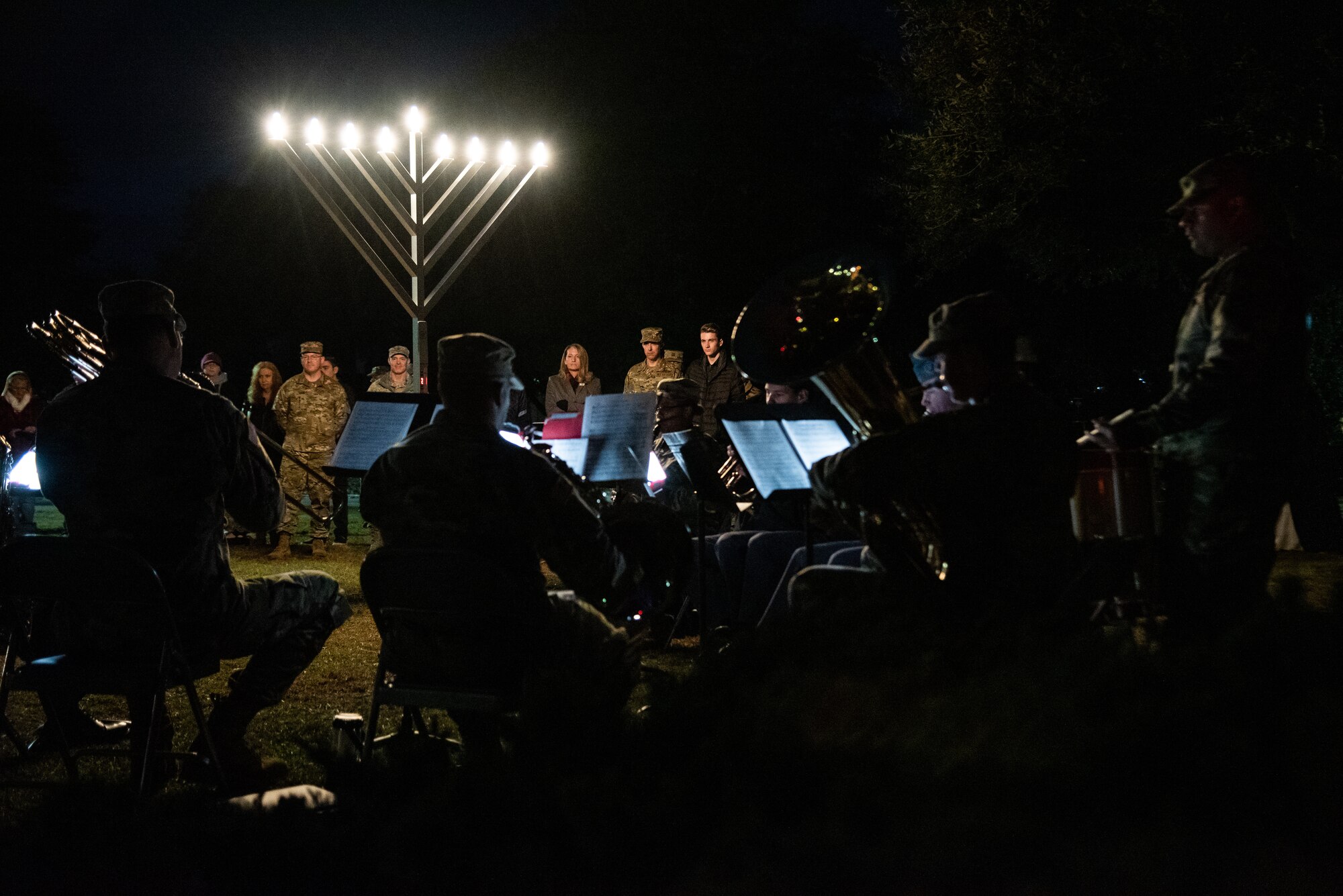 Spectators listen to a band perform holiday songs during the annual Holiday Display Lighting Ceremony at Shaw Air Force Base, S.C. Nov. 29, 2018.