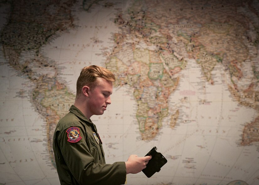 Airman 1st Class Kenyon Vickery, 15th Airlift Squadron loadmaster, checks his schedule on the squadron’s new app Nov. 30, 2018, at Joint Base Charleston, S.C. The 15th AS decided to employ an innovative, modern and efficient way of relaying scheduling information to the flyers via a smartphone application.