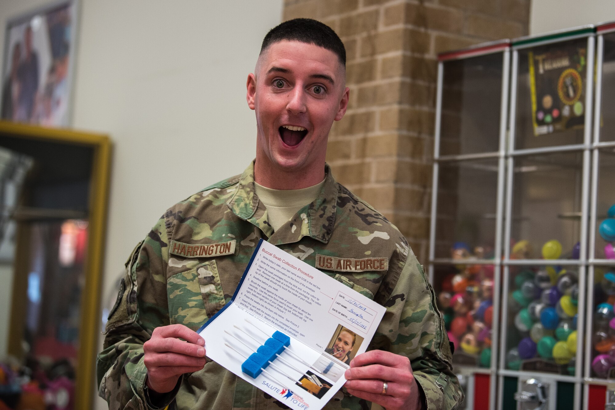 Technical Sgt. Sean Harrington, 27th Special Operations Security Forces Squadron kennel master, holds up a completed set of mouth swabs for bone marrow donor registration at Cannon Air Force Base, New Mexico, Nov. 30, 2018. The registration is done through Salute To Life, a program created to let Department of Defense members become bone marrow donors. (U.S. Air Force photo by Airman 1st Class Vernon Walter)