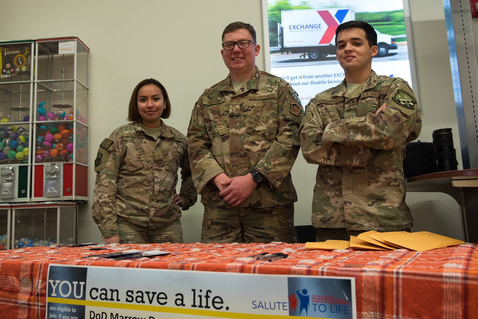 Volunteers from the 27th Special Operations Wing smile for the camera during a bone marrow donor registration event at Cannon Air Force Base, New Mexico, Nov. 30th, 2018. Representatives from different squadrons across Cannon AFB volunteered for six hours to help people through the registration process. (U.S. Air Force photo by Airman 1st Class Vernon Walter)