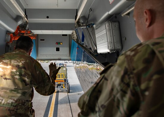 Logistics specialist load C-145A aircraft