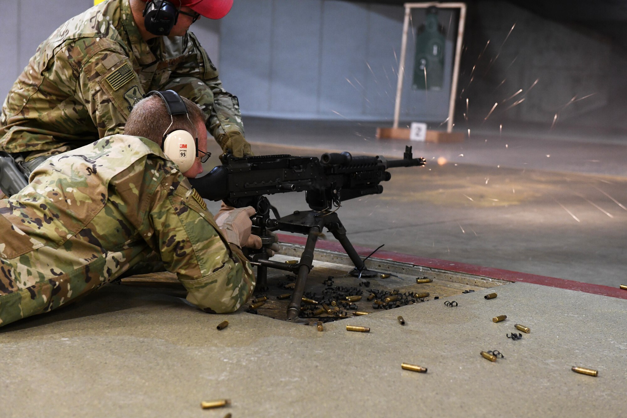 U.S. Air Force Maj. Gen. James Dawkins Jr., the 8th Air Force and J-GSOC commander, fires an M-240 Bravo machine gun while touring the combat arms training and maintenance building, or CATM, at Ellsworth Air Force Base, S.D., Nov. 13, 2018. Dawkins discussed how important lethality was for all Airmen during his all call. (U.S. Air Force photo by Airman 1st Class Thomas I. Karol)