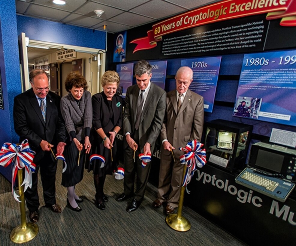 Photo of Senior executives from NSA and the National Cryptologic Museum Foundation cut the ribbon for the museum's newest exhibit.