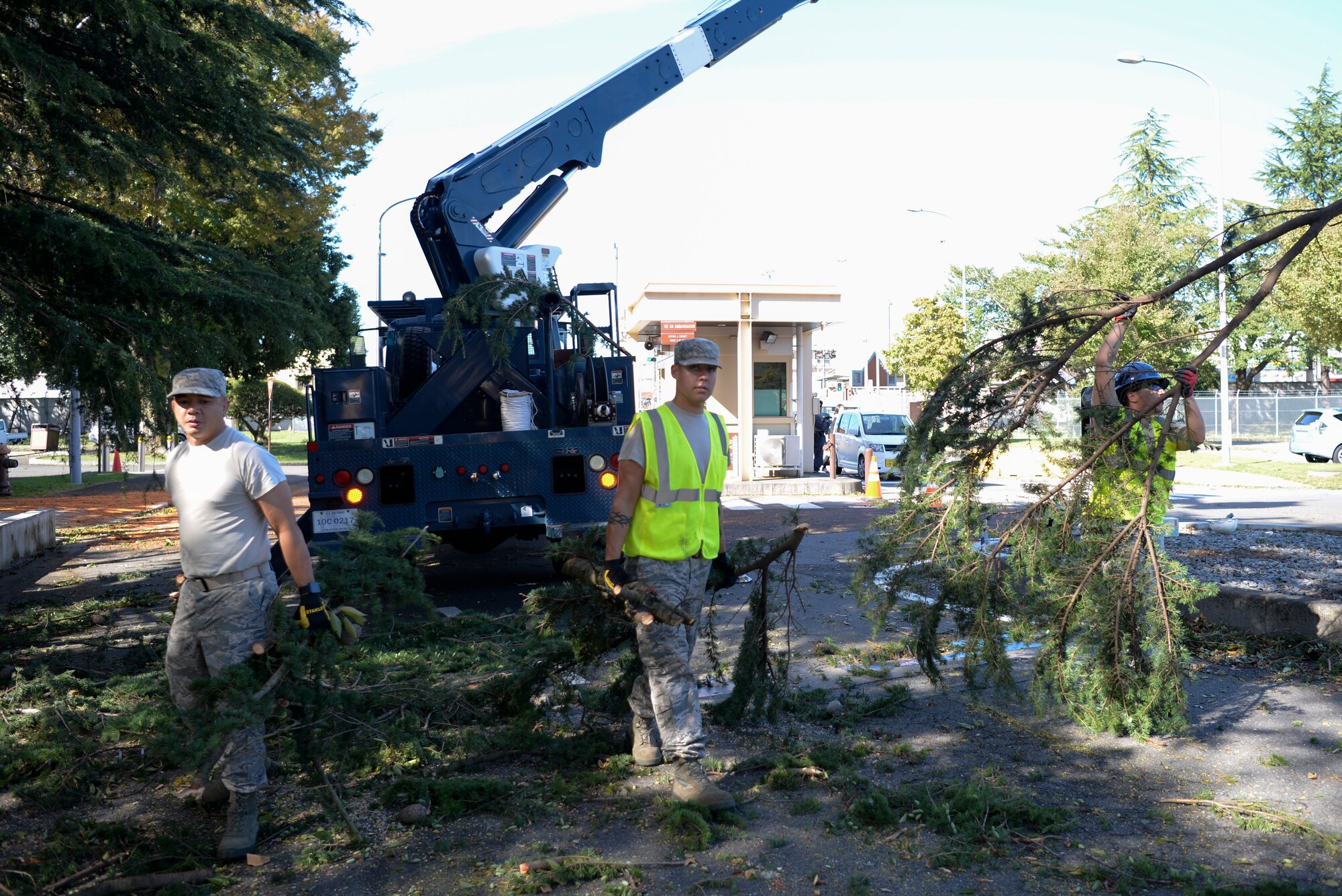 Airmen with the 374th Civil Engineer Squadron remove debris Oct. 1, 2018, at Yokota Air Base, Japan.