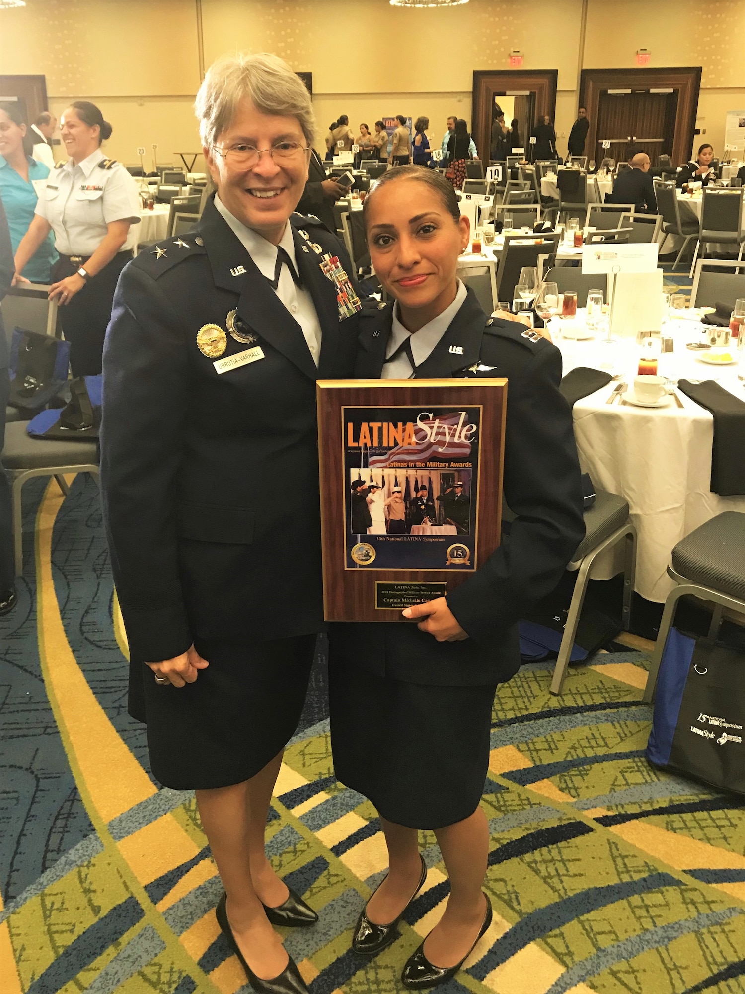 Airmen poses for a photo with Maj. Gen. Linda R. Urrutia-Varhall, the Director of Operations at the National Geospatial-Intelligence Agency.