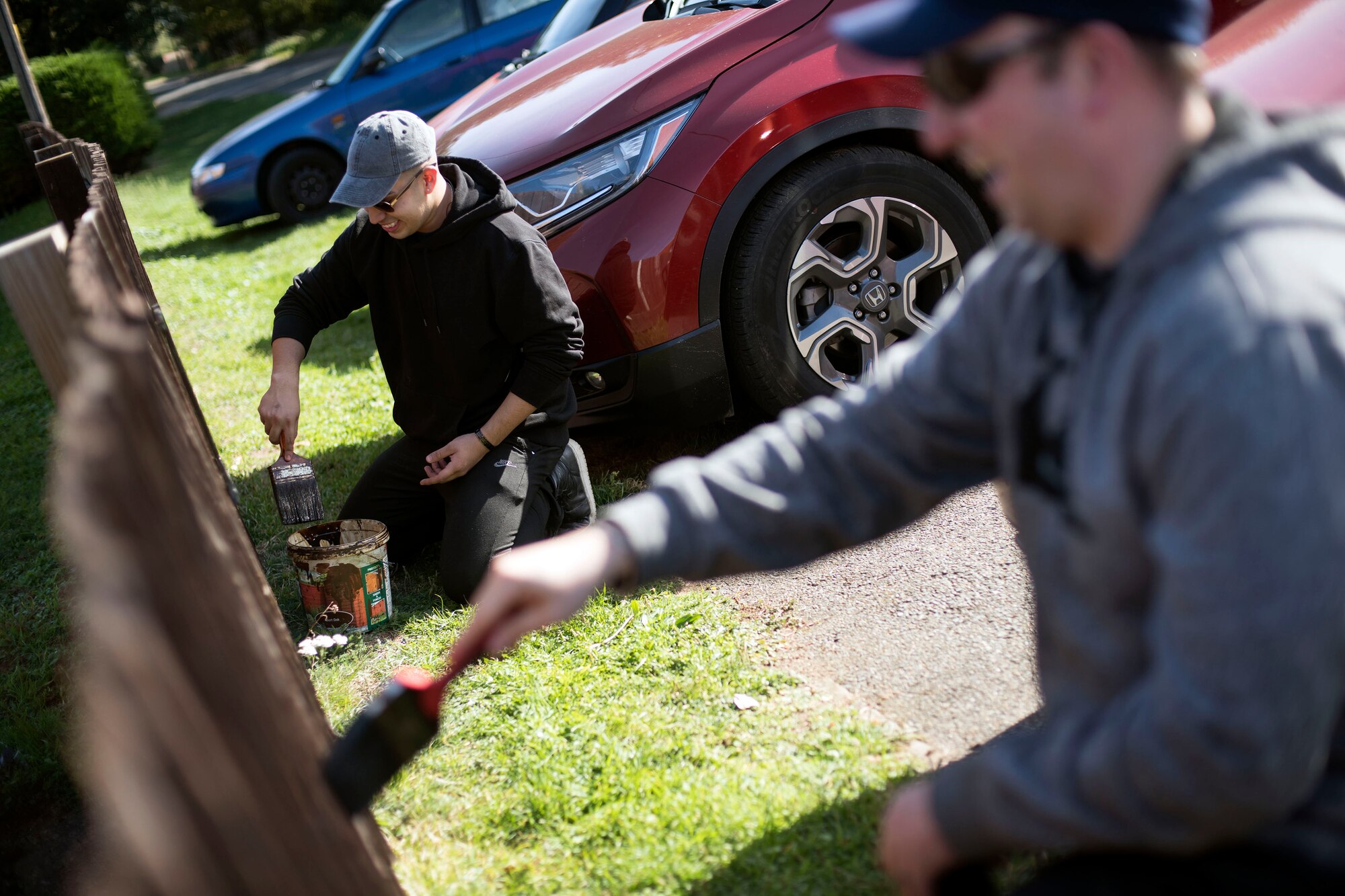 U.S. Air Force Senior Airman Josh Huerta, and U.S. Air Force Master Sgt. William Lodin, paint a fence while volunteering to help clean St. John’s Church in Beck Row, England, Sept. 29, 2018. Volunteers came from both the 48th Fighter Wing and 100th Air Refueling Wing to clean up the church grounds. (U.S. Air Force photo by Staff Sgt. Christine Groening)