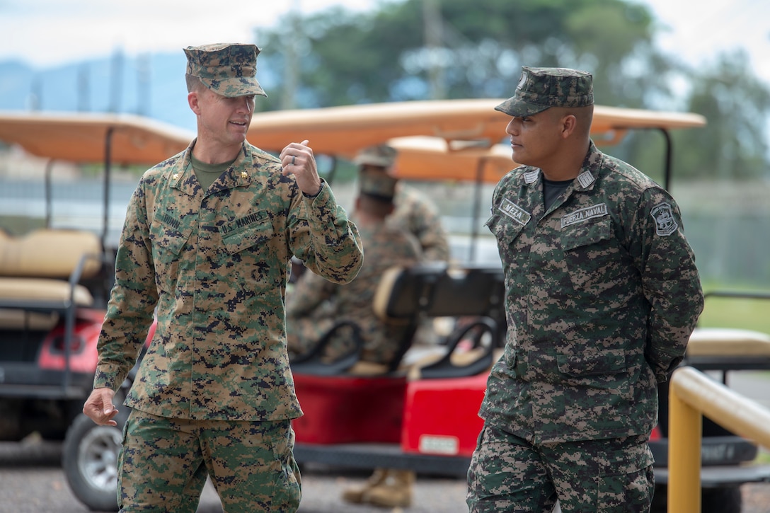 U.S. and Honduran military members speak.