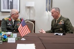 Marine Corps Gen. Joe Dunford, chairman of the Joint Chiefs of Staff, speaks with Turkish Gen.  Yaşar Güler, General Staff of the Republic of Turkey, during a bilateral meeting in between sessions of the NATO Military Committee Conference in Warsaw, Poland Sept. 29, 2018.