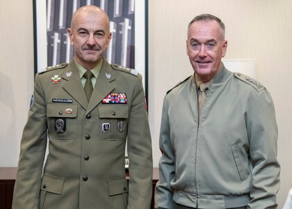 Marine Corps Gen. Joe Dunford, chairman of the Joint Chiefs of Staff, poses for a photo with Polish Lt. Gen. Rajmund Andrzejczak, chief of the general staff of the Polish Armed Forces, before a bilateral meeting in between sessions of the North Atlantic Treaty Organization (NATO) Military Committee Conference in Warsaw, Poland Sept. 29, 2018.