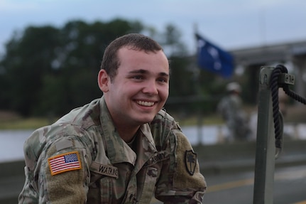 Spc. Cody Watkins, 125th Multi-Role Bridge Company crew member, participates in a training exercise on the Sampit River in Georgetown, South Carolina on Sept. 24, 2018. If the flooding gets as bad as expected, his fulltime mission will be on the water helping to transport emergency vehicles to and from the mainland.