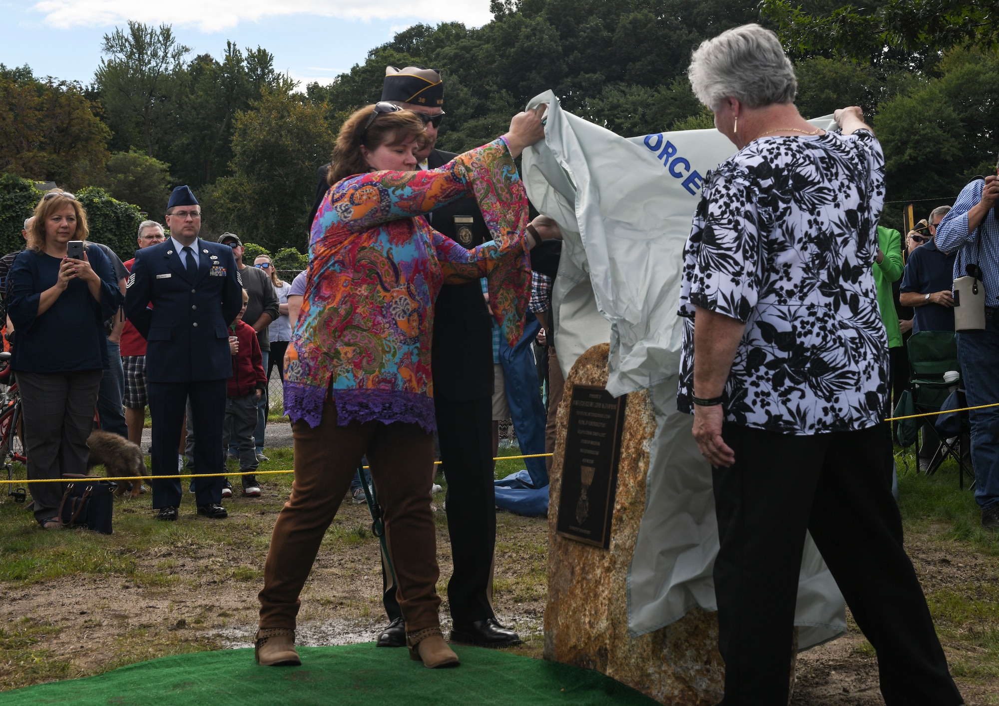 Terry and Lori Chapman, mother and sister of U.S. Master Sgt. John Chapman, unveil John Chapman’s Medal of Honor monument, Sept. 30, 2018, at Memorial Hall in Windsor Locks, Connecticut.