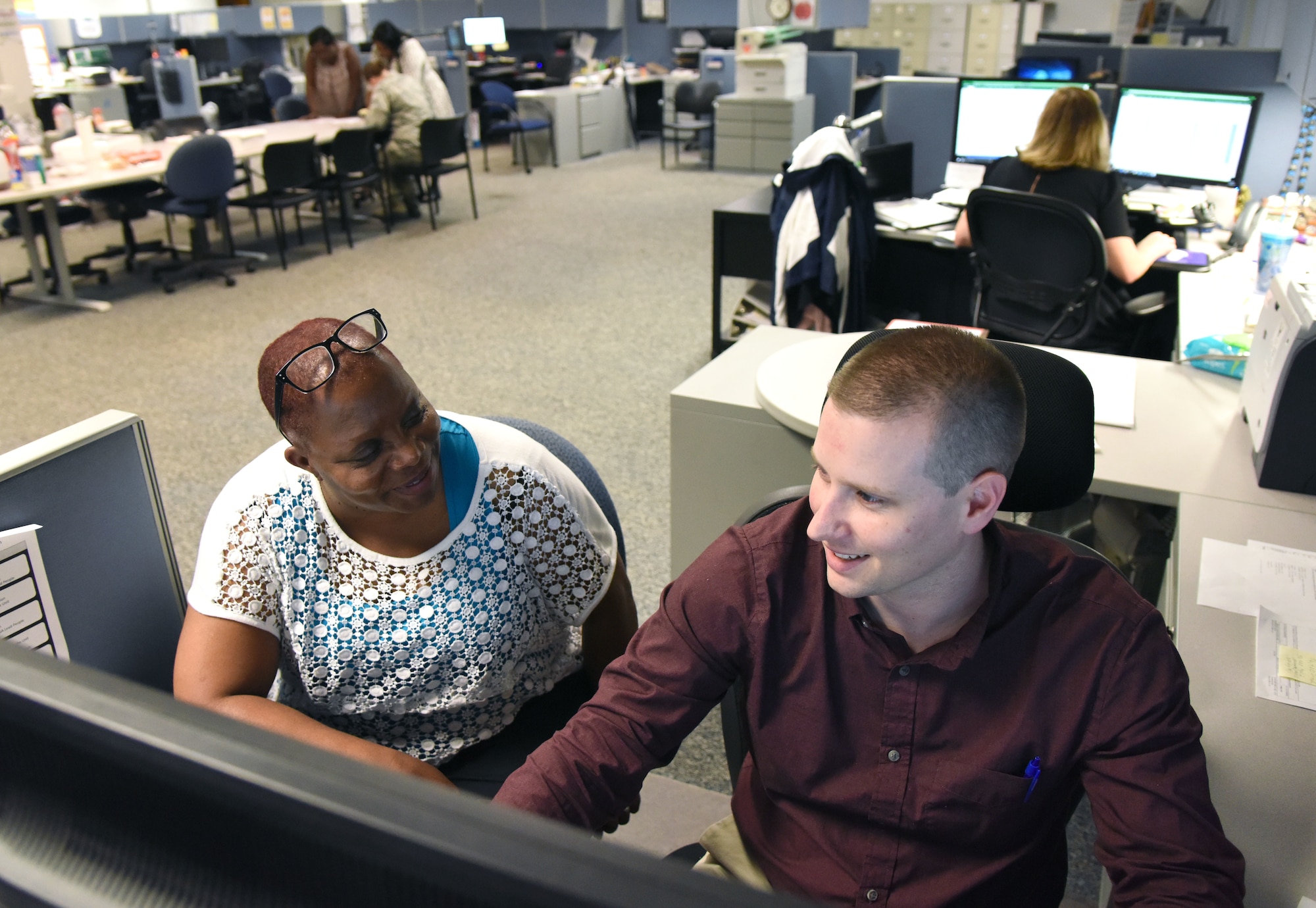 Dorothy Swims and James Westbrooke,  81st Comptroller Squadron budget analysts, work on the fiscal year 2018 end-of-year close-out at the Sablich Center at Keesler Air Force Base, Mississippi, Sept. 27, 2018. The purpose of the close-out was to execute 100% of Keesler's funding to maximize buying power. (U.S. Air Force photo by Kemberly Groue)