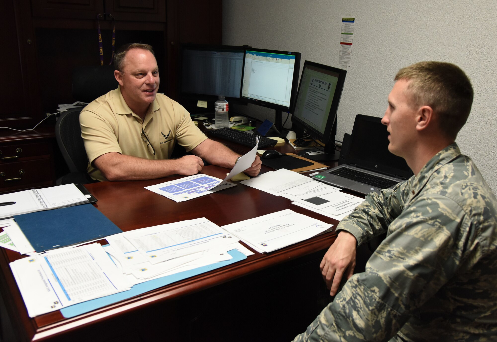 Tom Walker, 81st Comptroller Squadron deputy comptroller, and U.S. Air Force 2nd Lt. Bryan Case, 81st CPTS deputy flight commander, discuss the strategy during the fiscal year 2018 end-of-year close-out at the Sablich Center at Keesler Air Force Base, Mississippi, Sept. 27, 2018. The purpose of the close-out was to execute 100% of Keesler's funding to maximize buying power. (U.S. Air Force photo by Kemberly Groue)