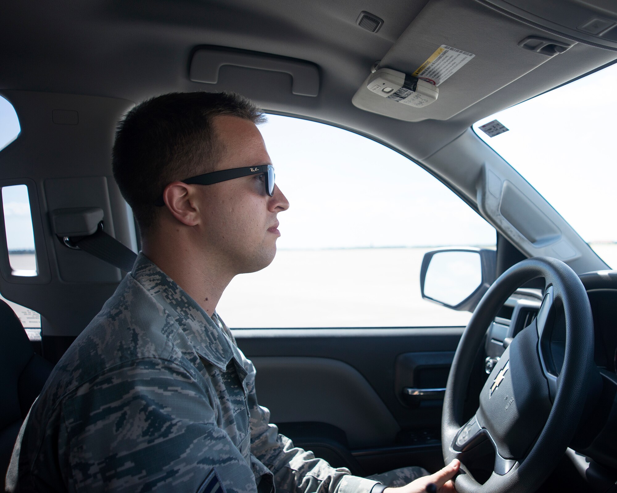 U.S Air Force Airman 1st Class Sean Holly, an airfield manager assigned to the 6th Operation Support Squadron, drives at truck on the flightline at MacDill Air Force Base, Florida, Sept. 28, 2018.