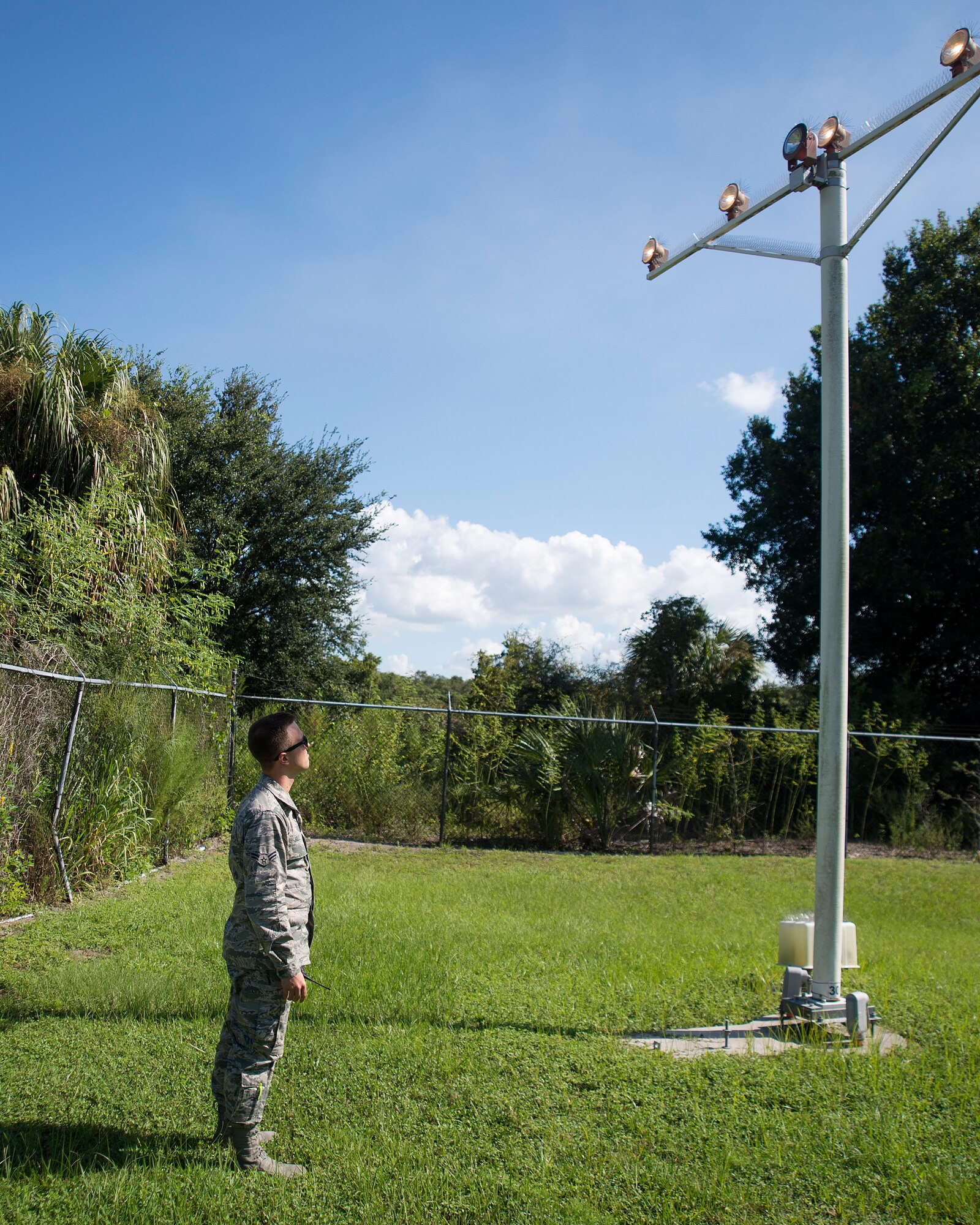 U.S Air Force Airman 1st Class Sean Holly, an airfield manager assigned to the 6th Operation Support Squadron, checks the approach light system at MacDill Air Force Base, Florida, Sept. 28, 2018.