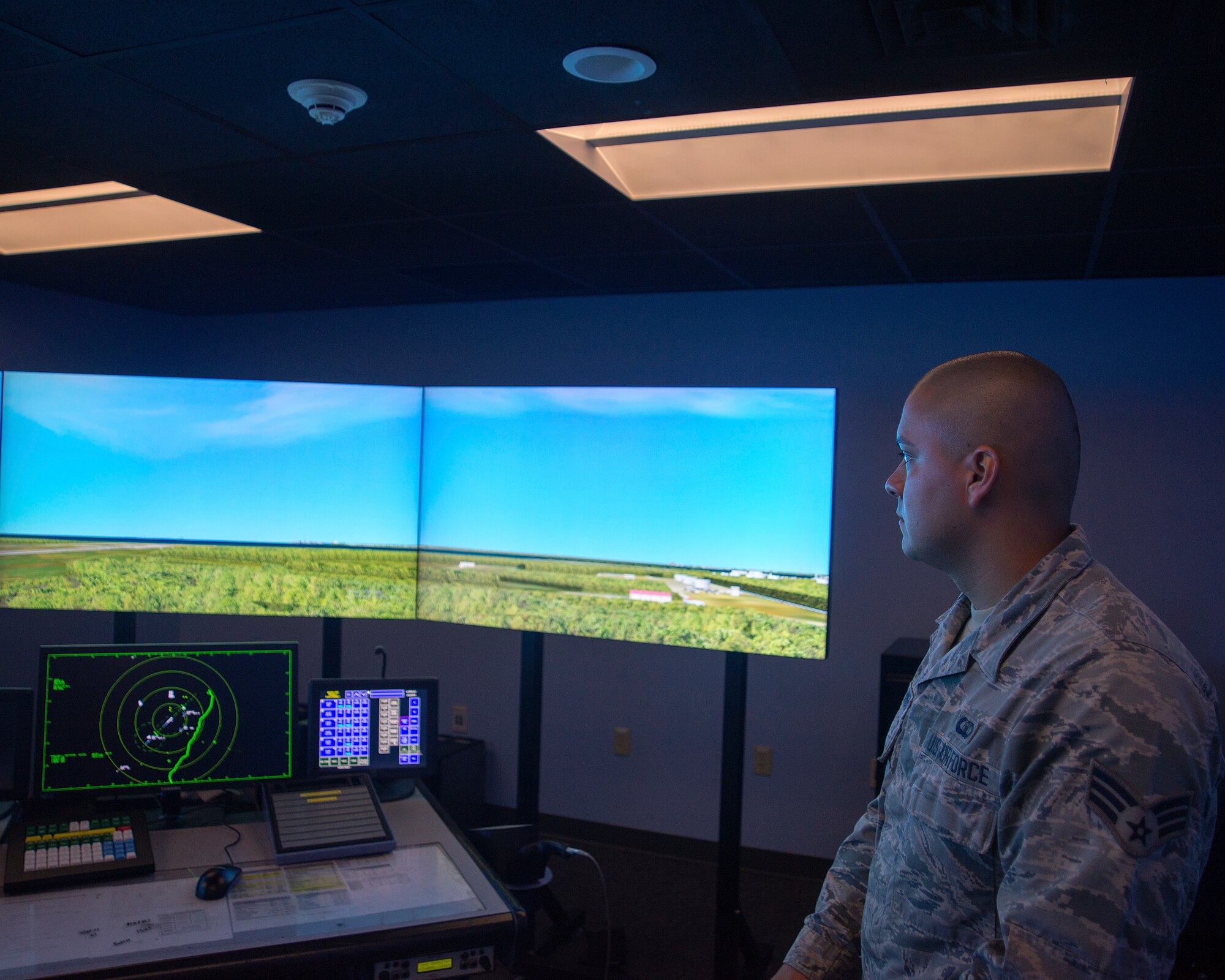 U.S Air Force Senior Airman Daryl Rivera-Rivera, air traffic control journeyman assigned to the 6th Operation Support Squadron, watches the air traffic control tower simulator on MacDill Air Force Base, Florida, Oct. 1, 2018.