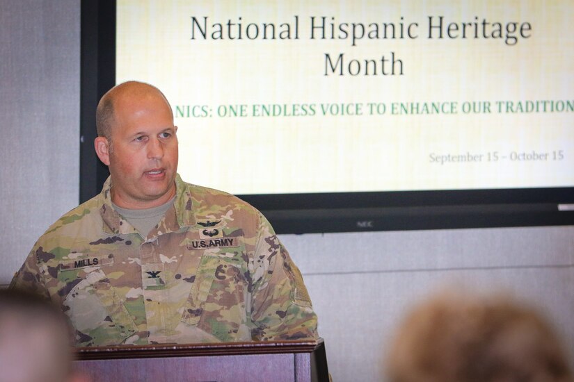 Col. Douglas W. Mills, commander of the 2503rd Digital Liaison Detachment, U.S. Army Central, shares his opening remarks at the National Hispanic Heritage Month observance ceremony at Patton Hall on Shaw Air Force Base, S.C., Sept. 27, 2018. The ceremony recognized the exceptional achievements and contributions that Hispanics have made in fighting and safeguarding the nation throughout history.