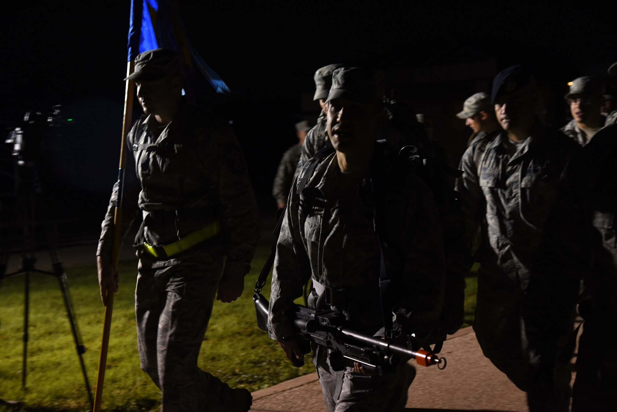 U.S. Air Force Col. Ricky Mills, 17th Training Wing commander, leads the Airman 1st Class Jacobson Memorial March at the parade field on Goodfellow Air Force Base, Texas, Sept. 28, 2018. Mills and other Airmen rucked with 21 pounds in their bag to signify the age of Airman 1st Class Elizabeth Jacobson when she was killed in action. (U.S. Air Force photo by Staff Sgt. Joshua Edwards/Released)