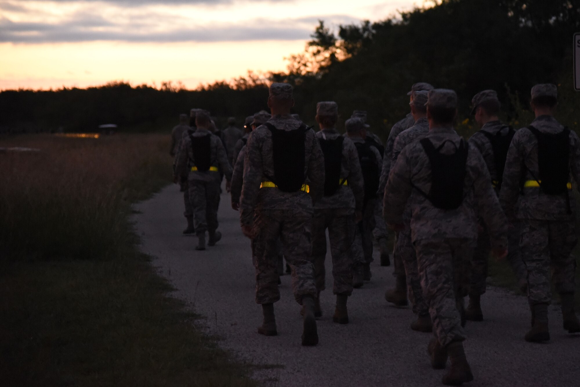 Airmen march along the perimeter during the Airman 1st Class Jacobson Memorial March on Goodfellow Air Force Base, Texas, Sept. 28, 2018. The 17th Security Forces Squadron hosted the event to honor one of their own fallen members. (U.S. Air Force photo by Staff Sgt. Joshua Edwards/Released)