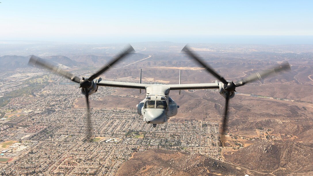 An MV-22 Osprey with Marine Medium Tiltrotor Squadron (VMM) 161, Marine Aircraft Group 16, 3rd Marine Aircraft Wing, flies over Southern California during the 2018 Marine Corps Air Station Miramar Air Show on MCAS Miramar, Calif., Sept 29. This year's air show honors "100 years of women in the Marine Corps" by featuring several performances and displays that highlight accomplishments and milestones women have made since the first female enlistee, Opha May Johnson, who joined the service in 1918.( U.S. Marine Corps Photo by Cpl. Joshua S. McAlpine)