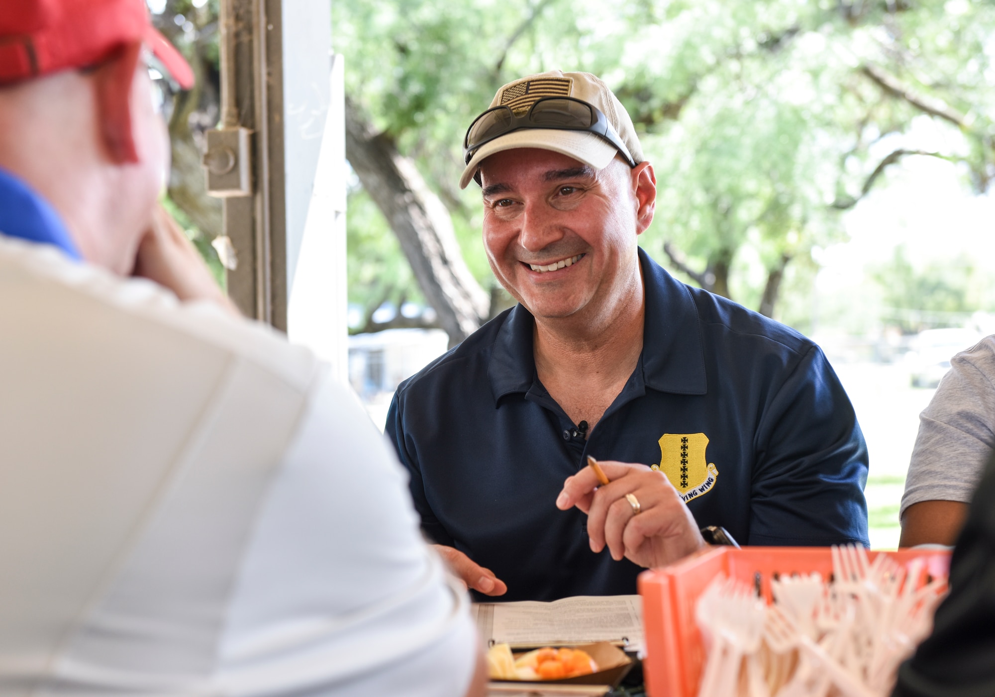 U.S. Air Force Col. Robert Ramirez, 17th Training Wing vice commander, laughs with fellow judges at the 44th Annual Armed Forces International Terlingua Chili Cook-Off during the Ruckus at the Rec Camp event at Goodfellow Air Force Base Recreation Camp, San Angelo, Texas, Sept. 29, 2018. The judges blind tasted over 20 different Terlingua chili during the cook-off. (U.S. Air Force photo by Aryn Lockhart/Released)