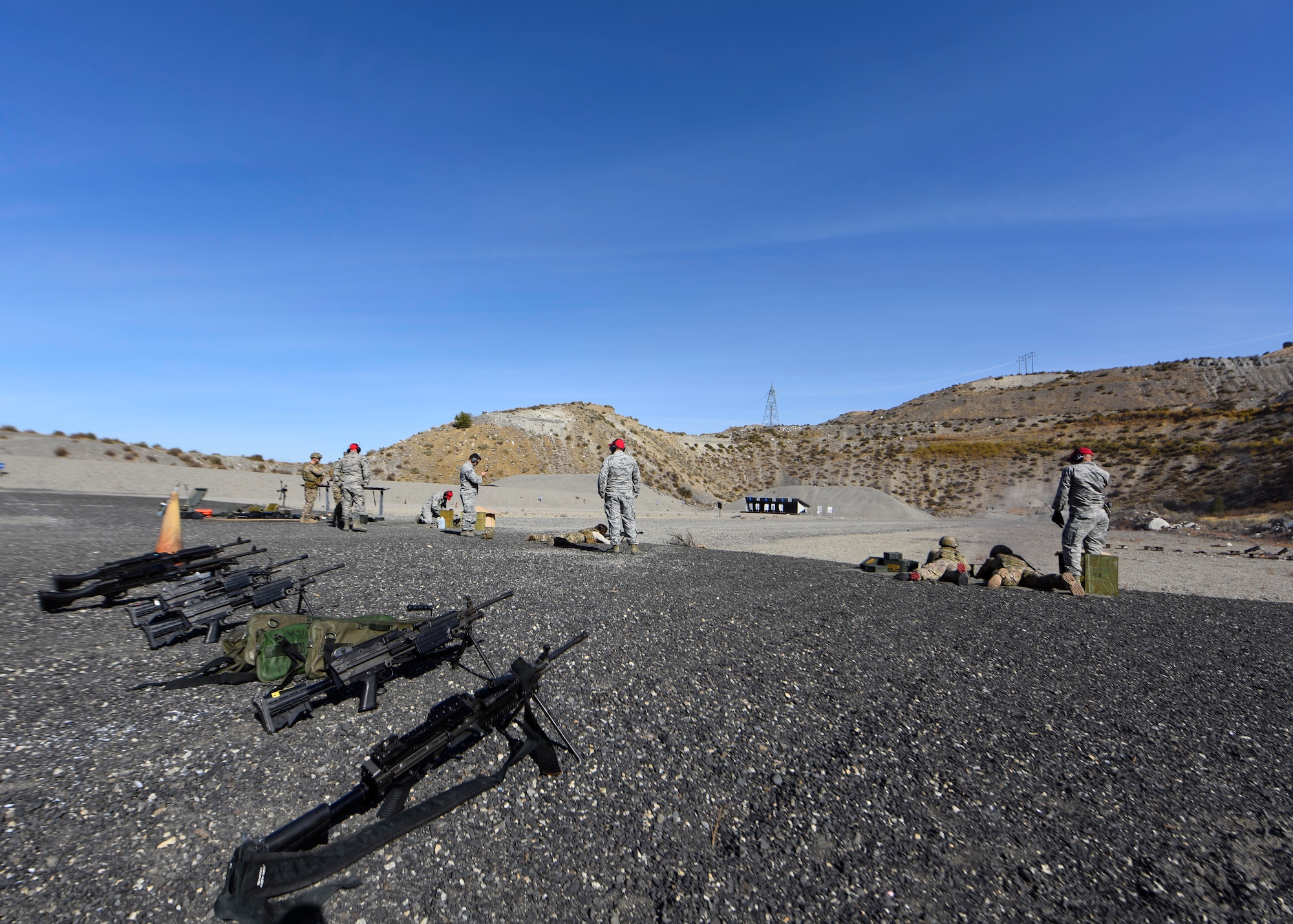 Airmen from the 92nd Security Forces Squadron and 92nd Civil Engineer Squadron explosive ordinance disposal team perform heavy weapons qualifications at Coulee Dam, Washington, Sept. 26, 2018. Airmen train with a variety of weapons systems including the M240B fully automatic rifle, 249AR fully automatic rifle and the Barret M107 caliber rifle to maintain proficiency and familiarization with the weapon. (U.S. Air Force photo/Airman 1st Class Lawrence Sena)