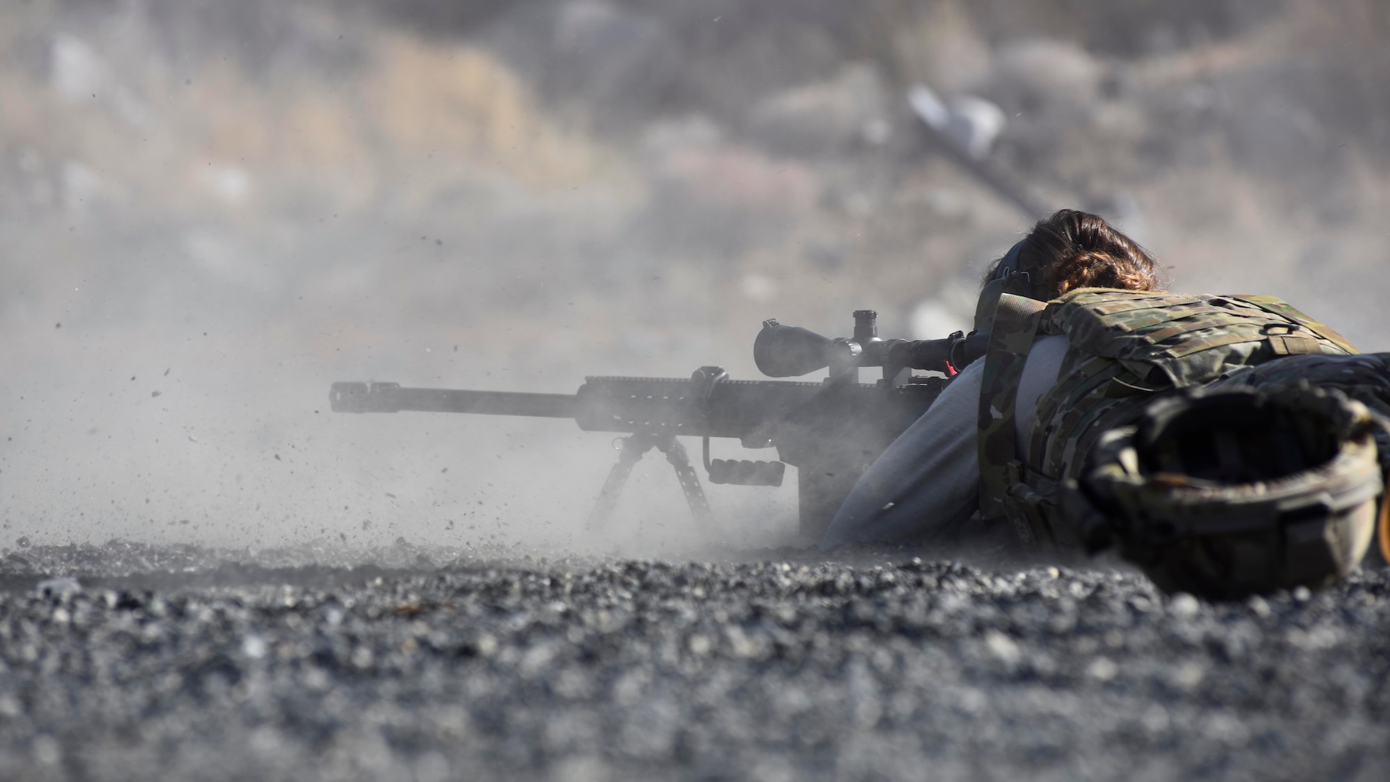 Senior Airman Erika Andresen, 92nd Civil Engineer Squadron explosive ordinance disposal technician, fires a Barret M107 caliber rifle as part of weapons familiarization training at Coulee Dam, Washington, Sept. 26, 2018. A part of EOD's mission set is irregular warfare, which requires them to be familiar with a variety of weapons systems in order to perform the mission. (U.S. Air Force photo/Airman 1st Class Lawrence Sena)