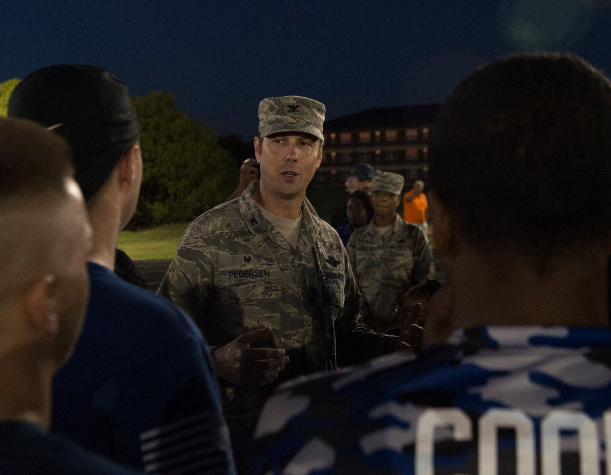 Col. Robert Pedersen, commander of the 97th Mission Support Group, congratulates the 97th Logistics Readiness Squadron football team on winning the 97th Air Mobility Wing Flag Football Championships Sept. 28, 2018 on Altus Air Force Base, Okla. The 97th Operations Support Squadron and the LRS played two games against each other with OSS winning the first, and LRS winning the second to become the champions. (U.S. Air Force photo by A1C Jeremy Wentworth)