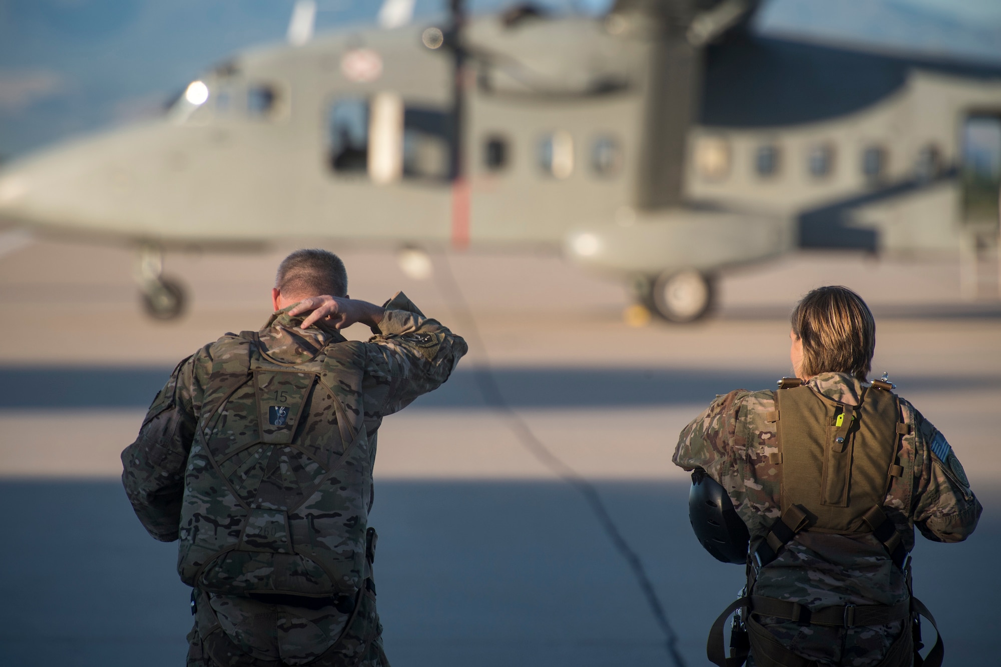 Col. Jason Pifer, left, 563d Rescue Group commander, and Col. Jennifer Short, 23d Wing commander, prepare to board a C-23 Sherpa prior to a high-altitude, low-opening jump, Sept. 27, 2018, at Davis-Monthan Air Force Base, Nev. Effective 1 Oct., the 563d RQG and its associated maintenance squadrons will be realigned from the 23d WG to the 355th Fighter Wing. (U.S. Air Force photo by Staff Sgt. Ryan Callaghan)