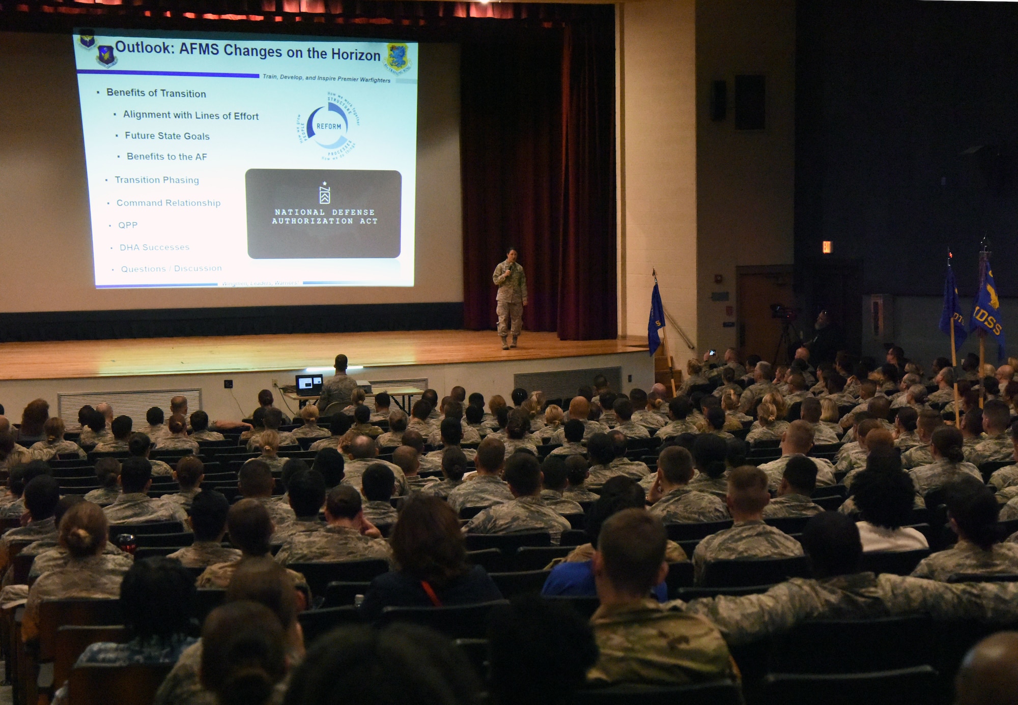 Col. Beatrice Dolihite, 81st Medical Group commander, briefs Keesler Medics on the Keesler Medical Center's transition to the Defense Health Agency during a commander's call at the Welch Theater on Keesler Air Force Base, Mississippi, Oct. 1, 2018. (U.S. Air Force photo by Kemberly Groue)