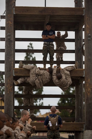 Recruits with Lima Company, 3rd Recruit Training Battalion, climb an obstacle during a confidence course at Marine Corps Recruit Depot San Diego, Sept. 24.