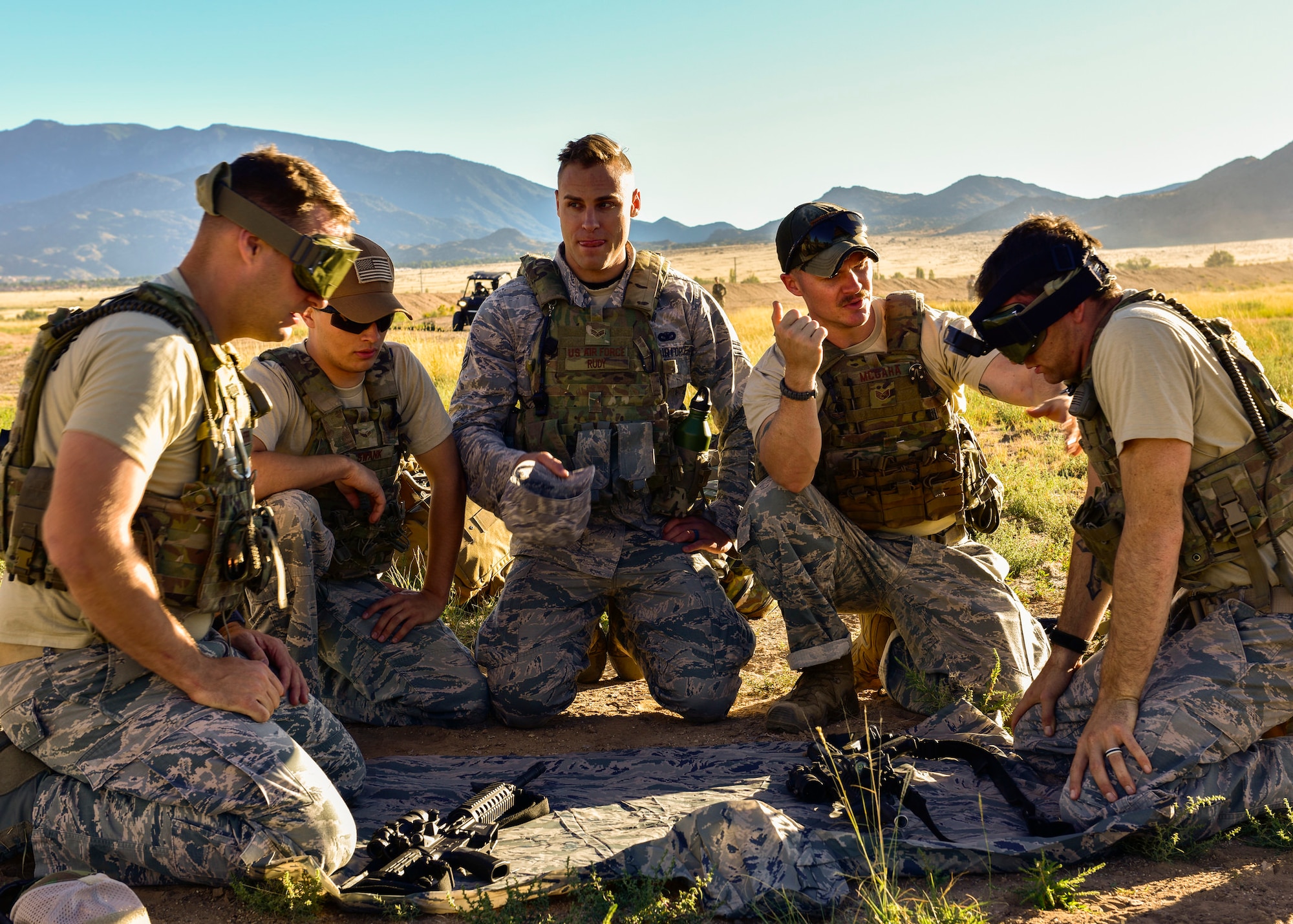Members of the 377th Weapons Systems Security Squadron's Charlie Flight team prepare to breakdown two M4 carbines as part of the 377th SFG Manzano Challenge here Sept. 28, 2018. Team members that were not blindfolded were able to verbally assist those that were breaking down, reassembling and performing a weapons check on the M4 carbines. (U.S. Air Force photo by Airman Austin J. Prisbrey)