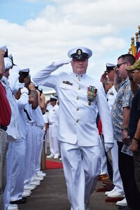 PHNSY & IMF’s Command Master Chief James R. Schneider (Center) is piped ashore during his retirement ceremony at the USS Bowfin memorial in Pearl Harbor. Schneider is retiring from the Navy after 29 years of dedicated service.