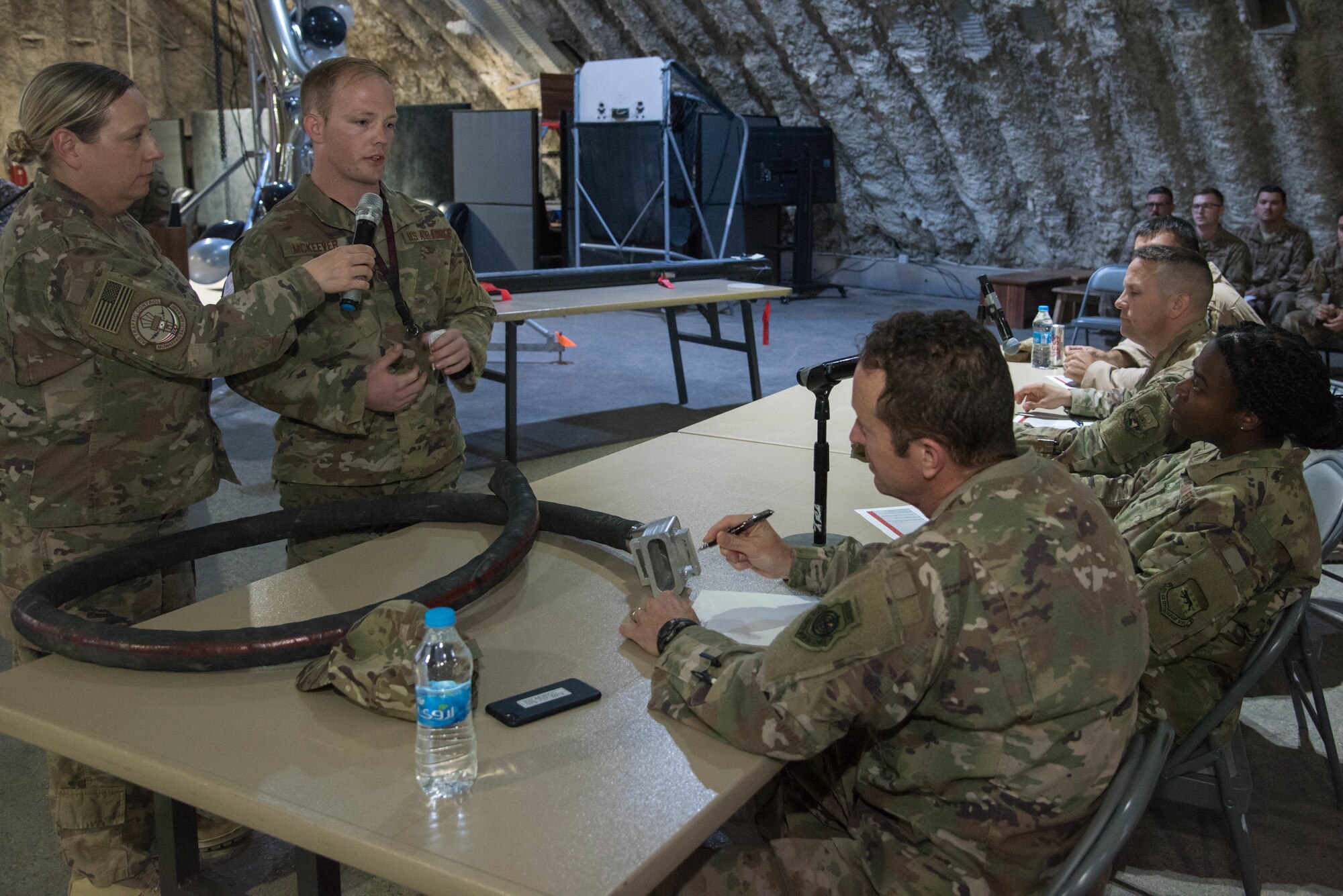 Staff Sgt. Devin McKeever, 332nd Expeditionary Maintenance Squadron fuel systems craftsman, answers questions about his idea for the Red Tails Commander’s Innovation Challenge, Sept. 28, 2018, at an undisclosed location in Southwest Asia.