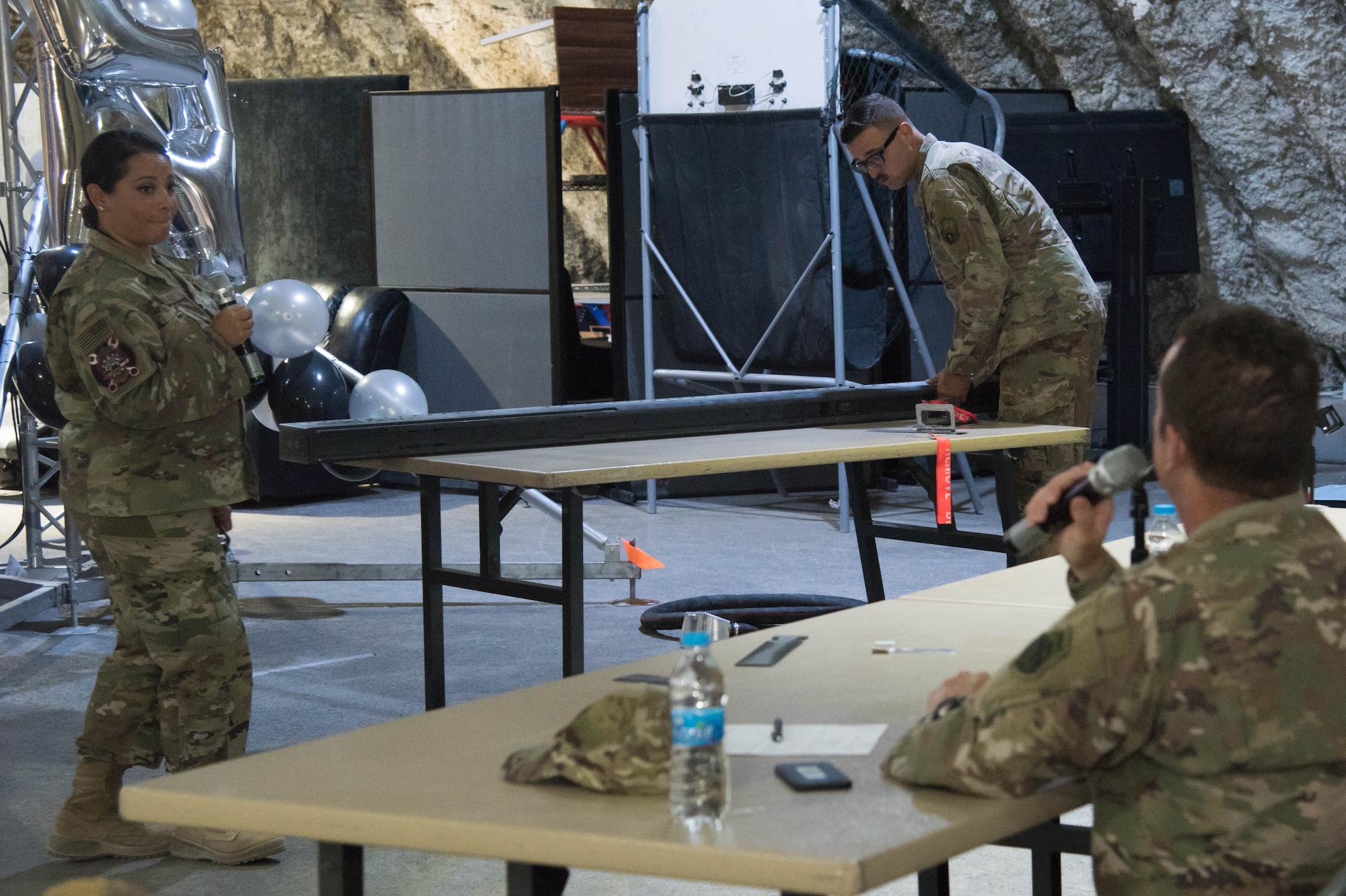 Staff Sgt. Nathan Newton, 332nd Expeditionary Maintenance Squadron aircraft structural maintenance technician, and Tech. Sgt. Oralia Howard, 332nd Expeditionary Maintenance Group quality assurance chief inspector, present their idea for the Red Tails Commander’s Innovation Challenge, Sept. 28, 2018, at an undisclosed location in Southwest Asia.