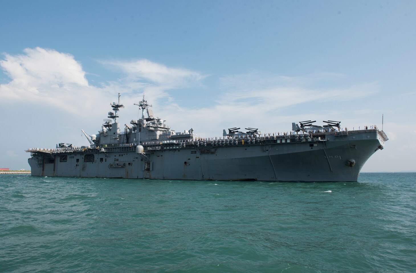 CHANGI NAVAL BASE, Singapore (October 2, 2018) The amphibious assault ship USS Wasp (LHD 1) arrives at Changi Naval Base in Singapore for a port visit. Wasp, the flagship for the Wasp Amphibious Ready Group, is operating in the Indo-Pacific region to enhance amphibious capabilities with regional partners and to serve as a ready-response force for any type of contingency.